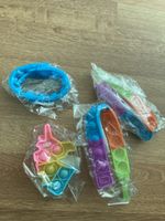 POP Up Armbänder und Anhänger