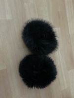 Schwarze Pelzstulpen