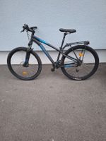 Mountainbike Rockrider schwarz blau mit Gepäckträger