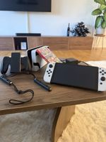 Nintendo Switch OLED Modell mit Mario Kart 8 Spiel, wie neu