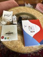 2 téléalarmes S12 de Swisscom avec une montre connectée 