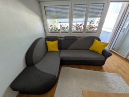 Ecksofa grau mit Bettfunktion und Stauraum