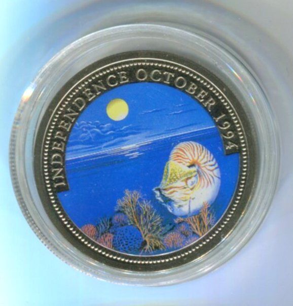Tutti le monete: Farbmünze "Perlboote. 1 $. Palau 1994". – Nuovo e nell'imballaggio originale da Basel venduto da Butsch5