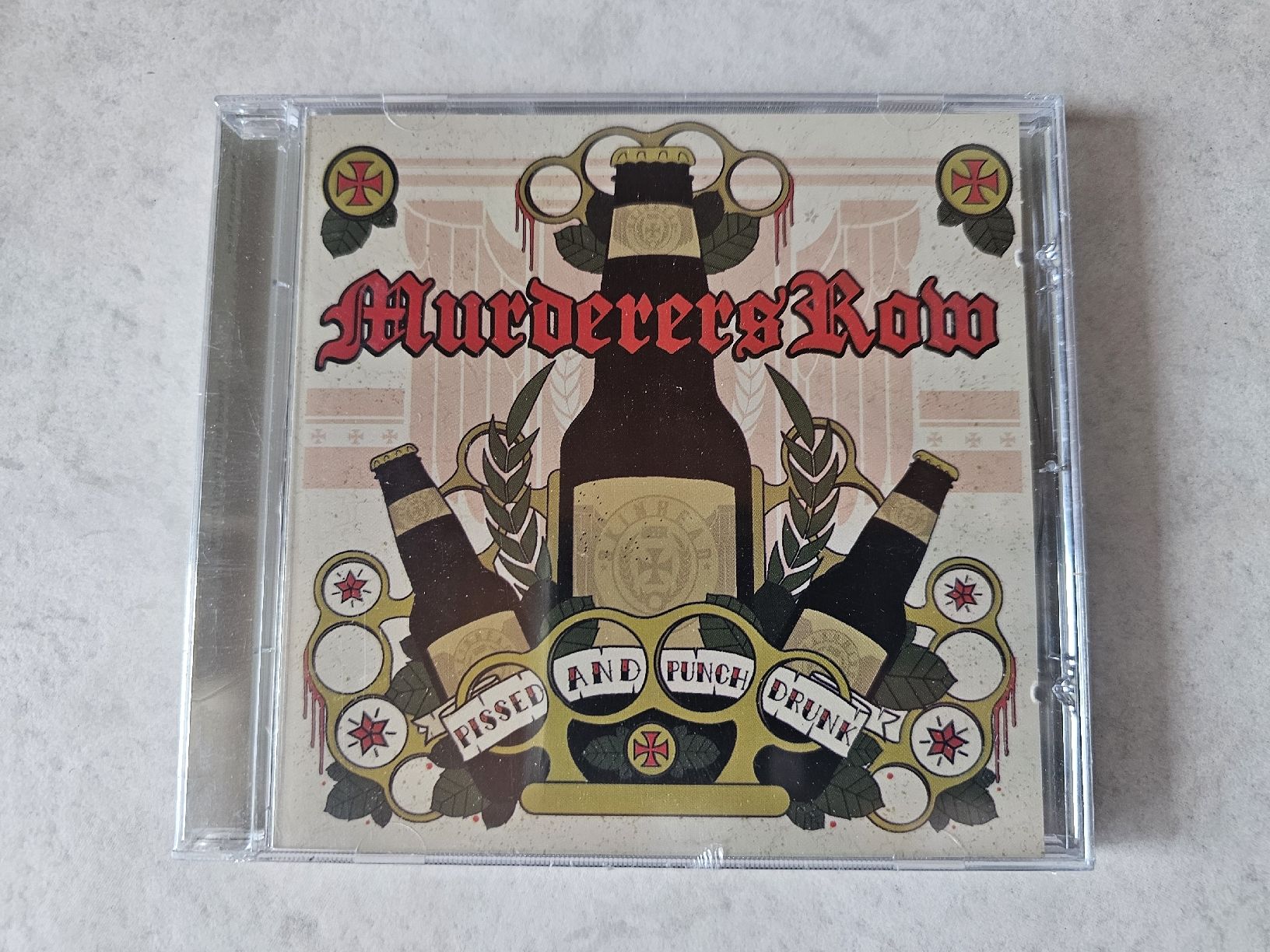 CD: Murderer's Row  -  Pissed And Punch Drink / Fabrikneu – Nuovo e nell'imballaggio originale da Schneisingen venduto da backstore24