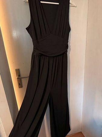 Jumpsuit noire jambe large tissu côtelée L