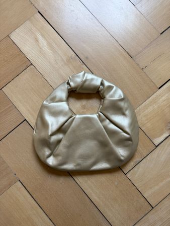 Handtasche gold rund