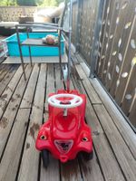 Laufrad und Auto mit Haltegriff