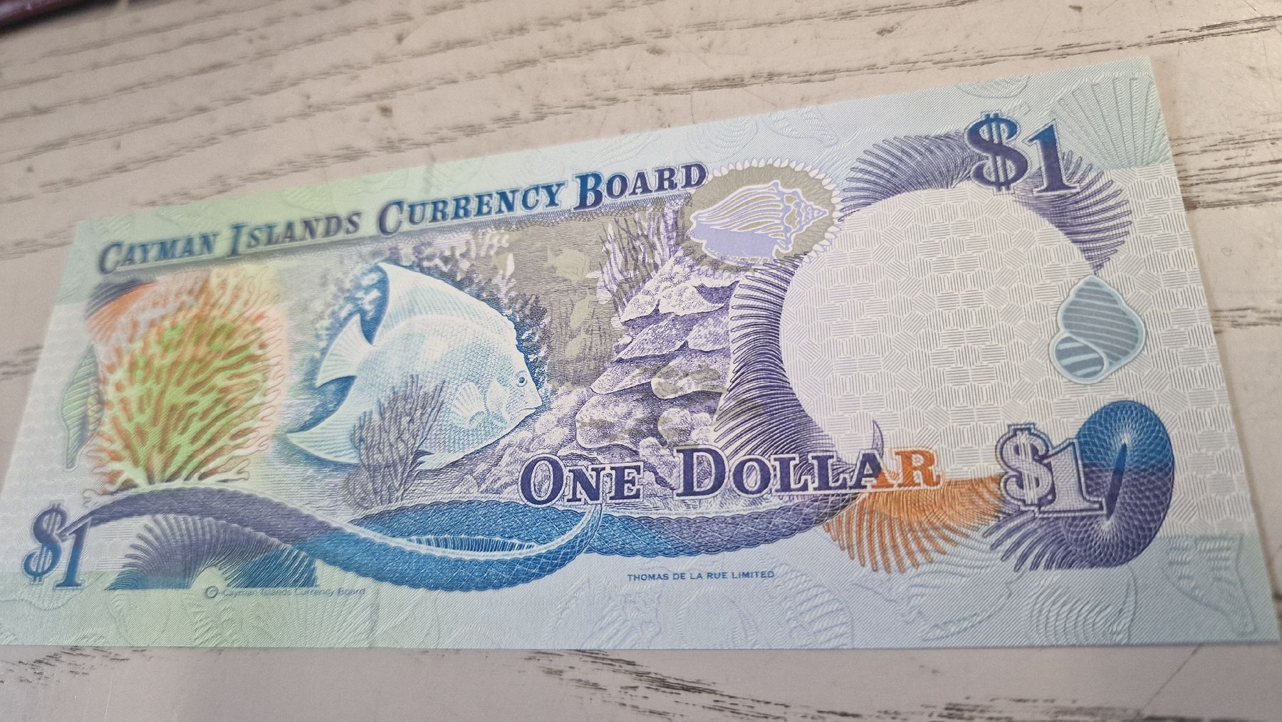 Banconote: Cayman Islands 1 Dollar Geldschein 1996 Series  – Nuovo e nell'imballaggio originale da Herisau venduto da Antiques.AR 1