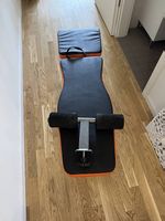 Banc de musculation pliable orange et noir, bon état