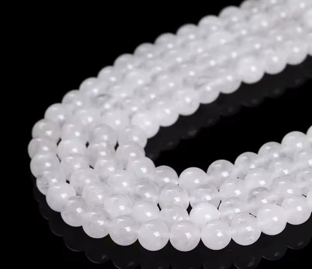 Minerali & Pietre curative: Milchquarz facettiert 8mm. Strang – Nuovo e nell'imballaggio originale da Menziken venduto da Mirager