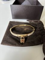 Bracelet jonc Michael Kors doré avec pierre zirconium