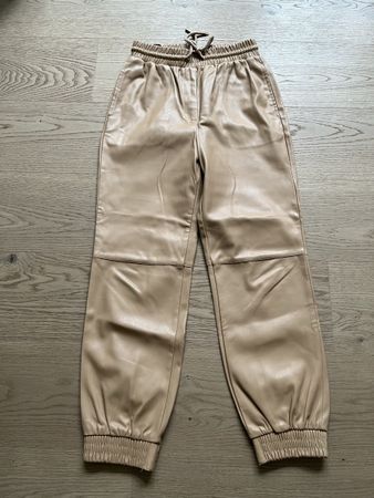 Pantaloni in ecopelle Edited di colore beige