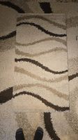 Deux tapis au motif identique: 228 x 155 et 80 x 150