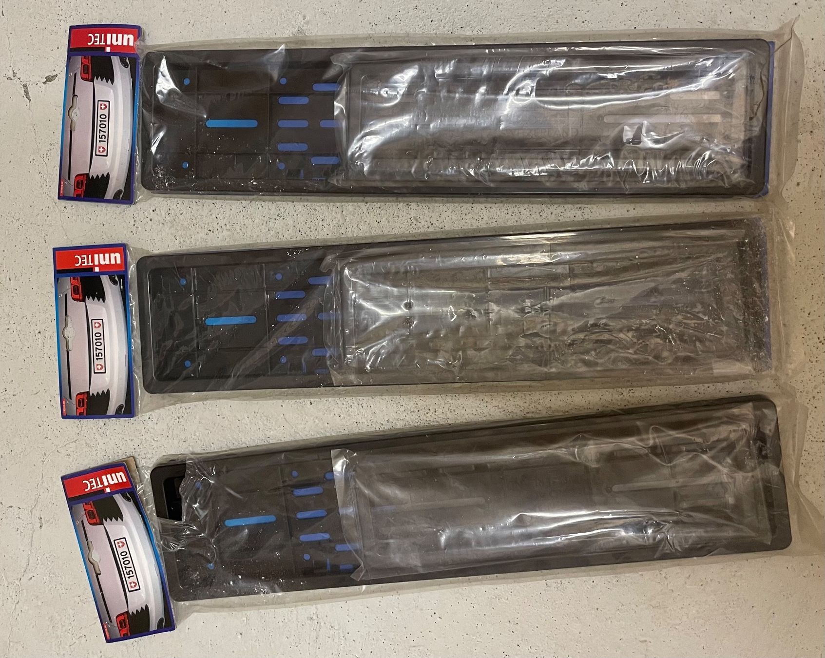 Supporti a parete: 3x UNITEC Kennzeichenhalter / Nummernrahmen (von Jumbo) – Nuovo e nell'imballaggio originale da Zürich venduto da Sarazrh