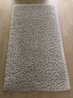 Tapis gris-beige