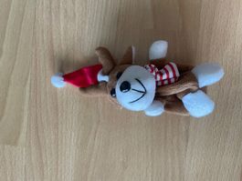 Stofftier Rentier mit Weihnachtsmütze und Schal