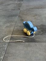 Wooden pull toy dinosaur blue yellow used condition