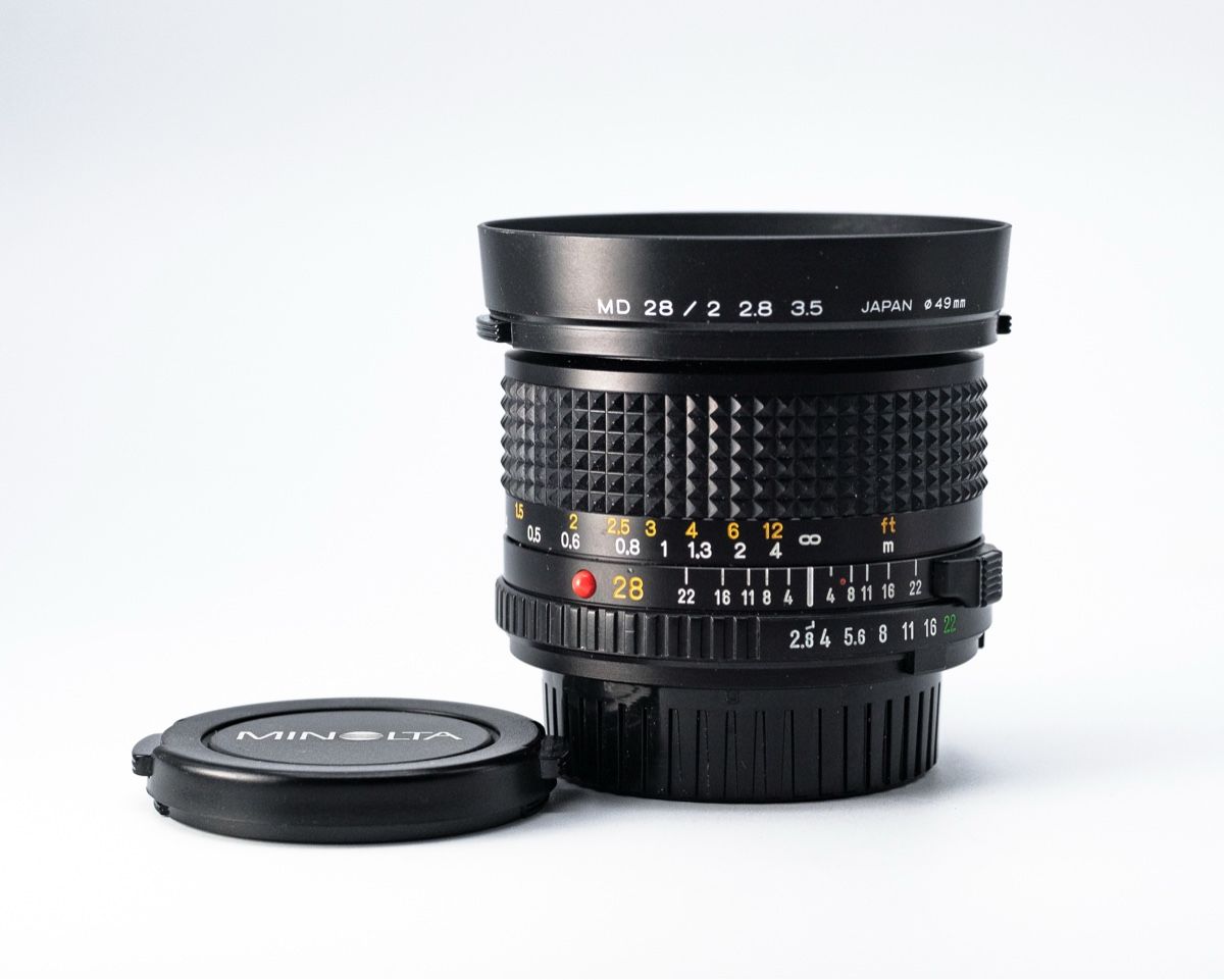 Minolta Objektive: Objectif MINOLTA MD 28mm 1:2.8 – Gebraucht aus Genève von Supablaz 1