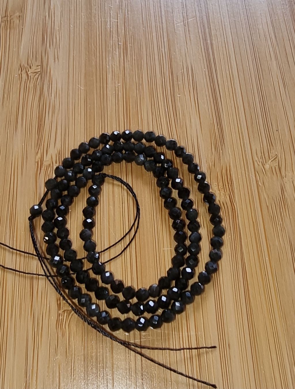 Minerali & Pietre curative: Obsidian facettiert 3mm. Strang – Nuovo e nell'imballaggio originale da Menziken venduto da Mirager