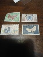 Lot de 4 timbres de Madagascar - papillons et industrie