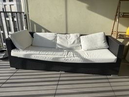 Outdoor Rattan Sofa black with white cushions used
