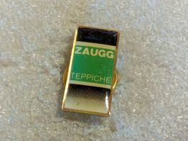 Ansteckpin 5: Zaugg Teppiche