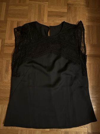 Belle petite blouse sans manche taille S 