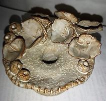 Kerzenständer mit 4 Blumen aus Keramik