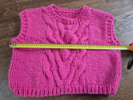 Handknitted pink vest
