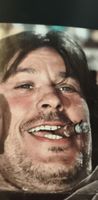 Photographie presse couleur Alain Delon cigare 