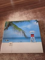 Männer am Meer - Mit dem Rücken zum Strand