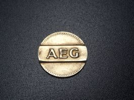Token: AEG Wertmarke für Münzzähler