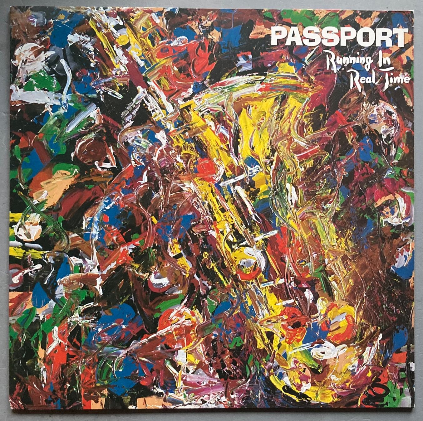 Vinyles: PASSPORT - RUNNING IN REAL TIME – D'occasion à Poliez-Pittet par Newtown-Records
