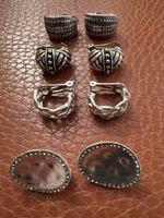 4 paires de boucles d’oreilles argentées selon phot