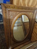 Miroir mural bois sculpté style baroque ornementé oval.