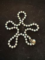 Collier de perle avec bout en argent 800