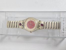 Swatch Uhr golden mit roten Akzenten gebrauchter Zustand