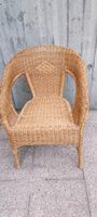 Sedia in rattan con braccioli buona condizione,bella comoda