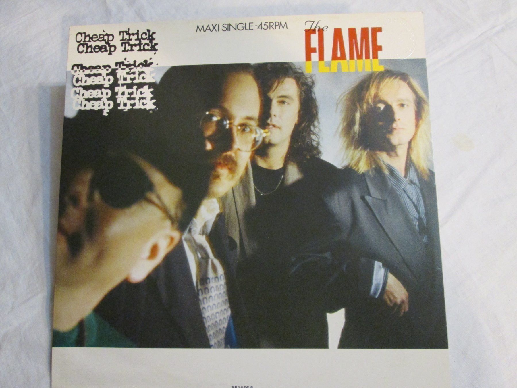 Dischi in vinile: Maxi Single 45t "The Flame" Cheap Trick 🔥 – Usato da la Chaux-de-Fonds venduto da Lampe