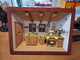 Handgefertigtes Diorama einer Uhrmacherwerkstatt im Rahmen