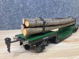 Märklin Spur 0 Tiefladewagen beladen mit Langholz, wie neu