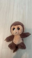 Adorable Beanie Boo monkey with glittery eyes, plush toy