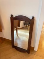 Antiker Ovalspiegel aus dunklem Holz