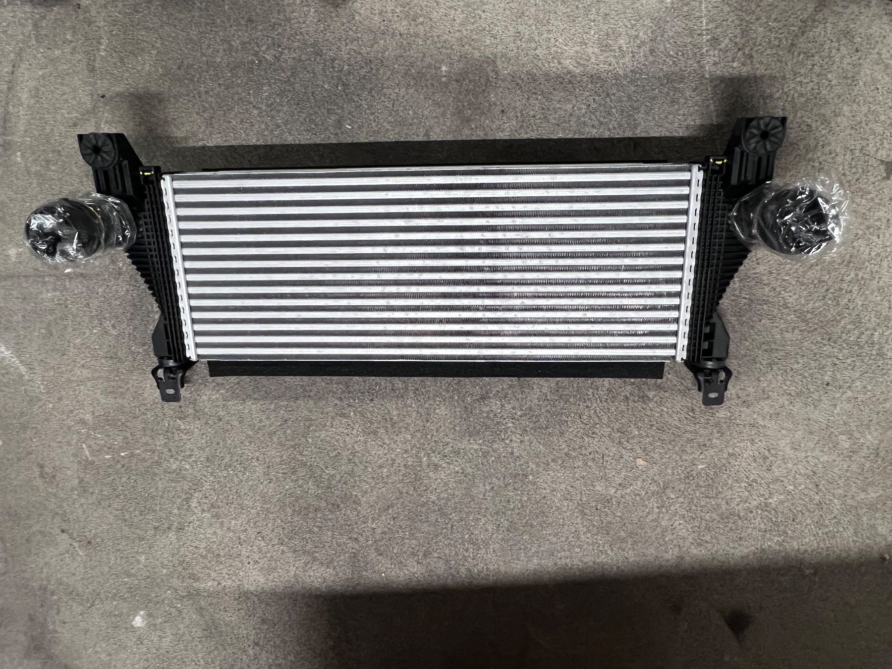 Tutti pezzi di ricambio auto: KÜHLER - LADELUFT MOTOR – Nuovo e nell'imballaggio originale da Cham venduto da Imholz-Autohaus