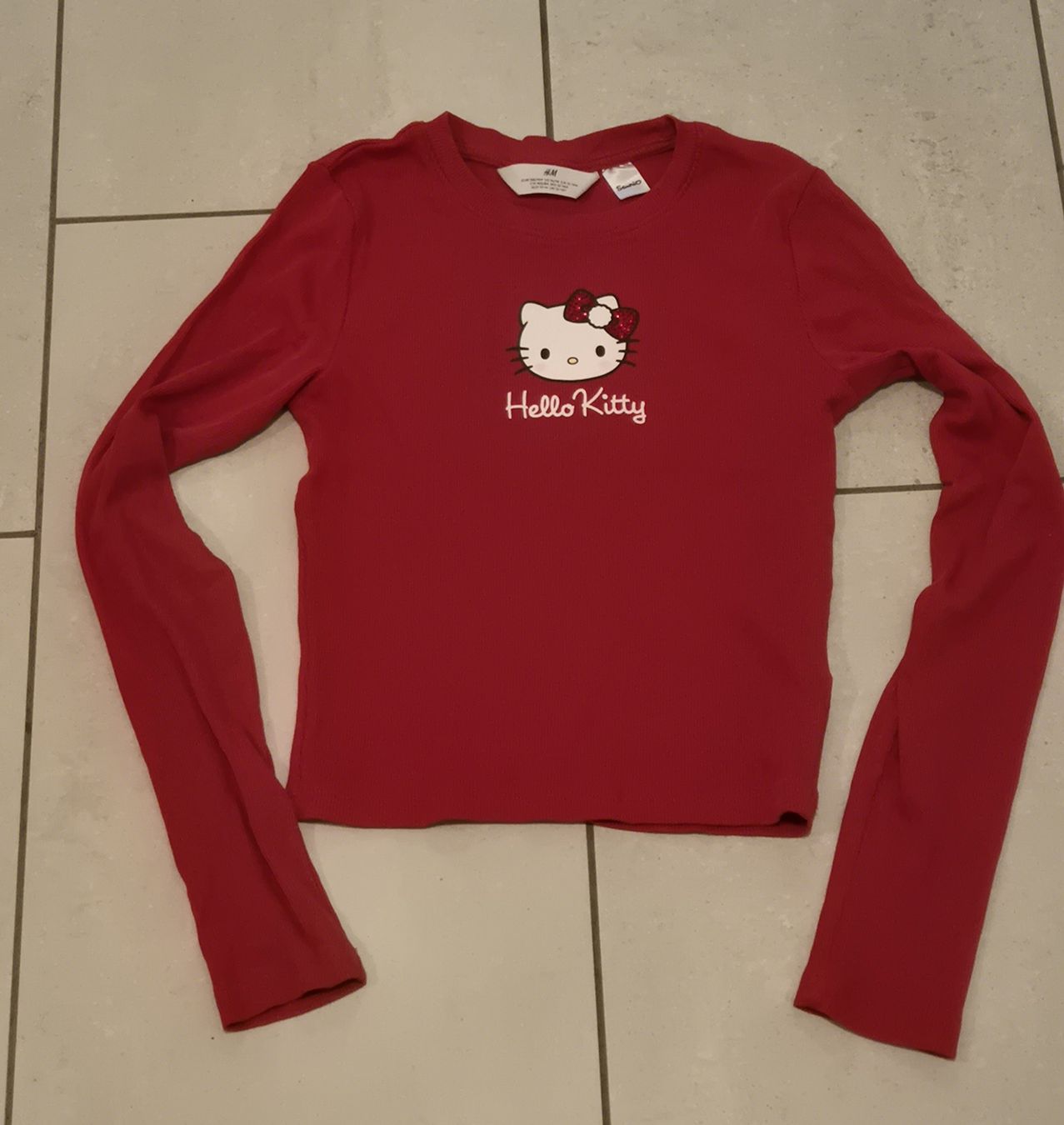 H&M Blouses, T-shirts & Tops: rotes Hello Kitty Oberteil 158/164  – D'occasion à Zofingen par Shile