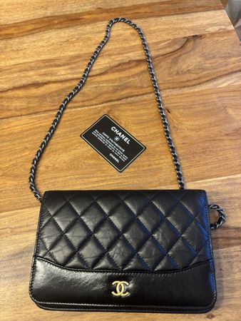 Chanel WOC Tasche schwarz Leder gesteppt gebrauchter Zustand
