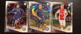 Three champions league cards with a connecting rain drop pat
