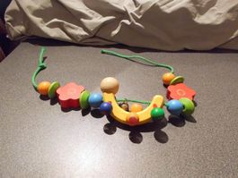 Kinderwagenkette Holz Banane farbig