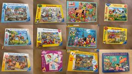 Mehrere Schachteln Kinderpuzzles