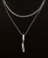 Collana doppia catena colore argento con pendente nuovo